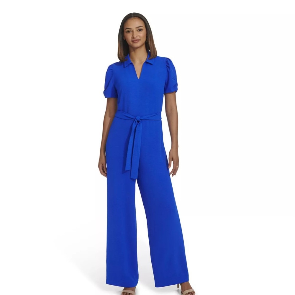 Beautiful blue short sleeve jumpsuit. Size small. Wide leg design, poof sleeve.